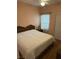 Bright bedroom with a queen-size bed and wood floors at 3810 Wiggins Bay St # 203, Las Vegas, NV 89129