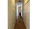 Long hallway with wood flooring and access to other rooms at 3810 Wiggins Bay St # 203, Las Vegas, NV 89129