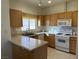 Bright kitchen features ample cabinetry, and modern appliances at 3810 Wiggins Bay St # 203, Las Vegas, NV 89129