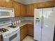 Kitchen boasts white appliances and plenty of counter space at 3810 Wiggins Bay St # 203, Las Vegas, NV 89129