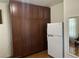 Walk-in pantry with ample shelving and wood cabinets at 3810 Wiggins Bay St # 203, Las Vegas, NV 89129