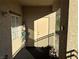 Sunlit patio with potted plants and access to the building at 3810 Wiggins Bay St # 203, Las Vegas, NV 89129