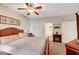 Primary bedroom with a king-size bed and ceiling fan at 3975 N Hualapai Way # 157, Las Vegas, NV 89129