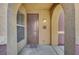 Inviting entryway with brown door and welcome mat at 3975 N Hualapai Way # 157, Las Vegas, NV 89129