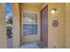 Well lit entryway with brown door and window at 3975 N Hualapai Way # 157, Las Vegas, NV 89129