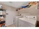 Laundry room with washer, dryer, and shelving at 3975 N Hualapai Way # 157, Las Vegas, NV 89129