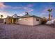 House exterior view, showcasing a spacious backyard at 4475 El Carnal Way, Las Vegas, NV 89121