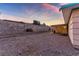 Large backyard with gravel ground cover and block wall at 4475 El Carnal Way, Las Vegas, NV 89121