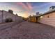 Gravel backyard with covered patio and block wall at 4475 El Carnal Way, Las Vegas, NV 89121