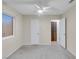 Bedroom with gray carpet, ceiling fan and window at 4475 El Carnal Way, Las Vegas, NV 89121