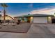 Ranch style home with landscaped yard and attached garage at 4475 El Carnal Way, Las Vegas, NV 89121