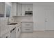 Modern kitchen with gray cabinets and granite countertops at 4475 El Carnal Way, Las Vegas, NV 89121