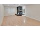 Living room with hardwood floors and stone fireplace at 4475 El Carnal Way, Las Vegas, NV 89121