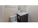 Bathroom with gray vanity, white sink, and shower/tub combo at 4476 Avondale Ave, Las Vegas, NV 89121