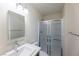 Clean bathroom with vanity, large mirror, and shower stall at 4476 Avondale Ave, Las Vegas, NV 89121