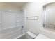 Clean bathroom with white tub, shower, and gray vanity at 4476 Avondale Ave, Las Vegas, NV 89121