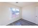 Bright bedroom with gray vinyl flooring and a window offering natural light at 4476 Avondale Ave, Las Vegas, NV 89121