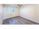 Simple bedroom featuring gray vinyl flooring and a ceiling fan at 4476 Avondale Ave, Las Vegas, NV 89121