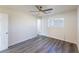 Spacious bedroom with gray flooring, ceiling fan, and access to bathroom at 4476 Avondale Ave, Las Vegas, NV 89121