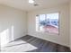 Bright bedroom with large window and gray flooring at 4476 Avondale Ave, Las Vegas, NV 89121