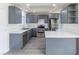 Renovated kitchen, featuring gray cabinets and stainless steel appliances at 4476 Avondale Ave, Las Vegas, NV 89121