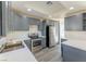 Modern kitchen featuring gray cabinets, stainless steel appliances, and quartz countertops at 4476 Avondale Ave, Las Vegas, NV 89121