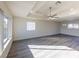 Bright living room with gray vinyl flooring and ceiling fan at 4476 Avondale Ave, Las Vegas, NV 89121