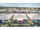 Aerial view of houses with red patio umbrella, community, and desert landscape at 4720 E Cactus Canyon Dr, Pahrump, NV 89061