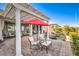 Backyard patio with pergola, seating, and umbrella at 4720 E Cactus Canyon Dr, Pahrump, NV 89061