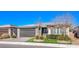 Beautiful curb appeal with a two-car garage and landscaped yard at 4720 E Cactus Canyon Dr, Pahrump, NV 89061