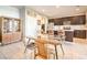 Modern kitchen with dark cabinetry and a glass dining table at 4720 E Cactus Canyon Dr, Pahrump, NV 89061