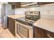 Stainless steel range, microwave, and light colored countertops in kitchen at 4720 E Cactus Canyon Dr, Pahrump, NV 89061