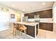 Modern kitchen with island, stainless steel appliances, and dark cabinetry at 4720 E Cactus Canyon Dr, Pahrump, NV 89061