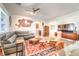 Living room with gray sectional sofa and eclectic decor at 4720 E Cactus Canyon Dr, Pahrump, NV 89061