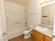 Bathroom with tub, toilet, and wood vanity at 4730 E Craig Rd # 2028, Las Vegas, NV 89115