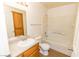 Clean bathroom with tub, toilet and wood vanity at 4730 E Craig Rd # 2028, Las Vegas, NV 89115