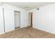 Bedroom with mirrored closet doors and neutral carpeting at 4730 E Craig Rd # 2028, Las Vegas, NV 89115