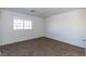 Simple bedroom with window and neutral colored carpet at 4730 E Craig Rd # 2028, Las Vegas, NV 89115