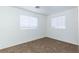 Spacious bedroom with two windows and neutral wall colors at 4730 E Craig Rd # 2028, Las Vegas, NV 89115