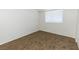 Bright bedroom with neutral carpeting and large window at 4730 E Craig Rd # 2028, Las Vegas, NV 89115