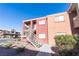 Two-story condo building with stairs and landscaping at 4730 E Craig Rd # 2028, Las Vegas, NV 89115