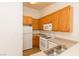 Kitchen with wood cabinets, gas range, and dishwasher at 4730 E Craig Rd # 2028, Las Vegas, NV 89115