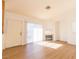 Living room with laminate floors, fireplace, and sliding door at 4730 E Craig Rd # 2028, Las Vegas, NV 89115