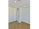 Light and airy bedroom with wood-look flooring and a closet at 5116 Golden Ln # A, Las Vegas, NV 89119