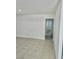 Clean hallway with tile floors leading to bedrooms and bath at 5116 Golden Ln # A, Las Vegas, NV 89119