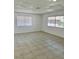 Spacious living area with tile floors and large windows at 5116 Golden Ln # A, Las Vegas, NV 89119