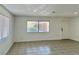 Bright living room featuring tile floors and neutral walls at 5116 Golden Ln # A, Las Vegas, NV 89119