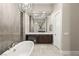 Spa-like bathroom with double vanity and large mirror at 5167 Rock Daisy Dr, Las Vegas, NV 89135