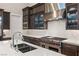 Modern kitchen with stainless steel appliances and white backsplash at 5167 Rock Daisy Dr, Las Vegas, NV 89135