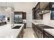 Gourmet kitchen boasts stainless steel appliances and quartz countertops at 5167 Rock Daisy Dr, Las Vegas, NV 89135